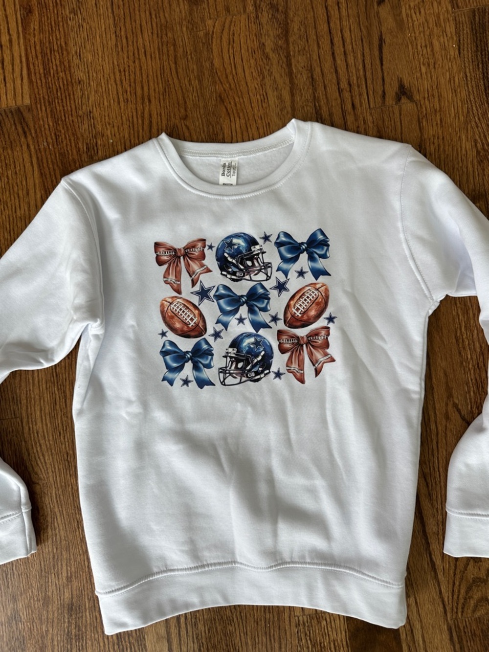Gildan White Sweatshirt with Blue Helmets and Brown Footballs Bow Design